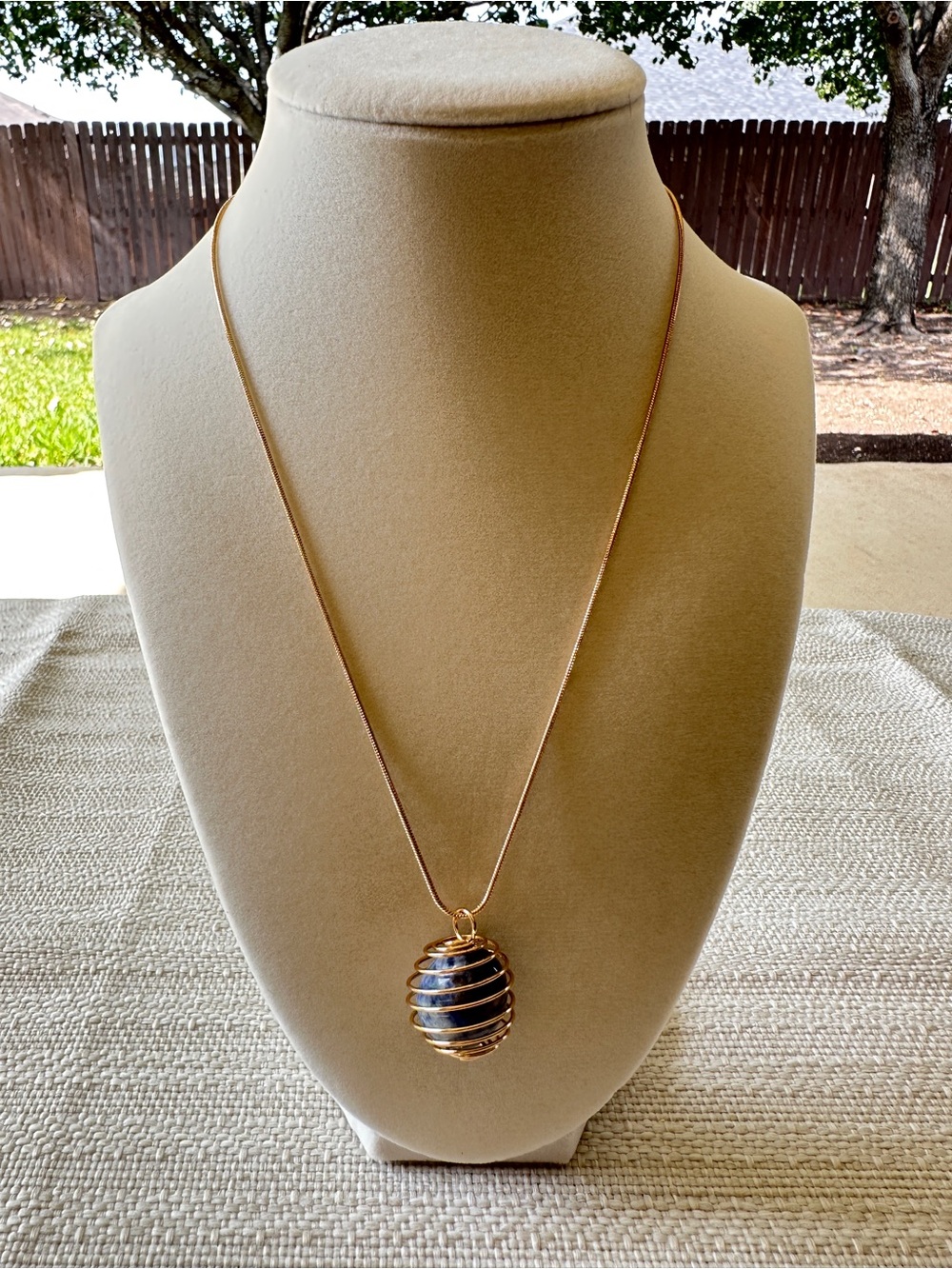 Gold-Tone Spiral Cage Pendant Necklace with Black Stone